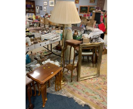 An oak plant stand with a brass effect standard lamp, gilt mirror and nest of tables 