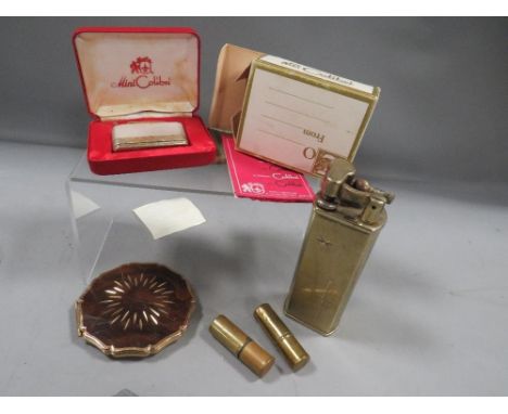 Four vintage lighters, a powder compact and military jack knife 