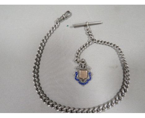 An antique silver gents pocket watch Albert chain 