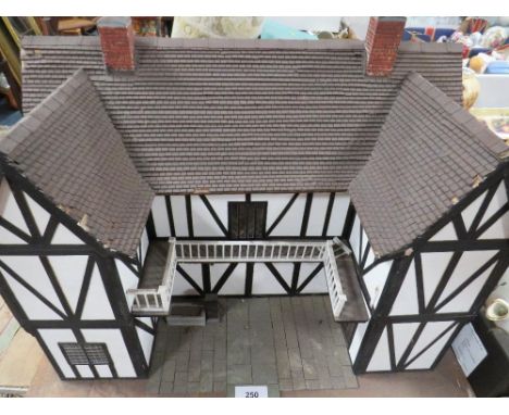 A vintage handmade wooden dolls house 
