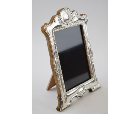Hallmarked silver fronted photo frame with wooden easel back, London 2022, 21cm tall.  