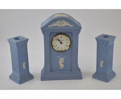 Wedgwood Blue Jasperware Millenium Dancing Hours mantle clock with a matching pair of garniture candlesticks (3).  In good co