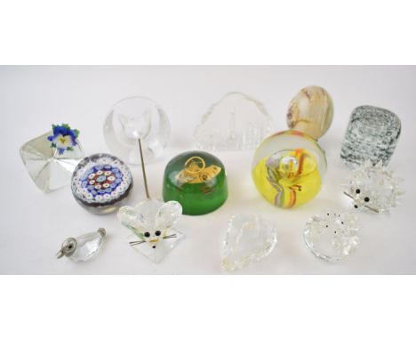 A collection of glass paperweights to include Caithness Saffron, a millefiori example, Swarovski figures and others (Qty).  C