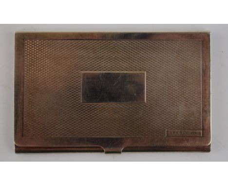 A sterling silver card case with engine turned design to front and space to add a monogram. 92x57mm. Weight 57.4g.  In excell