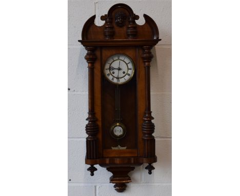 Edwardian chiming Vienna Wall clock with ceramic dial with brass banding and roman numerals. Ceramic pendulum with R = A Reta