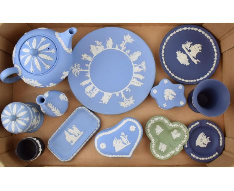 A collection of Wedgwood Jasperware to include teapot (seconds), bud vases, lidded pots, trinket trays and pin dishes in colo