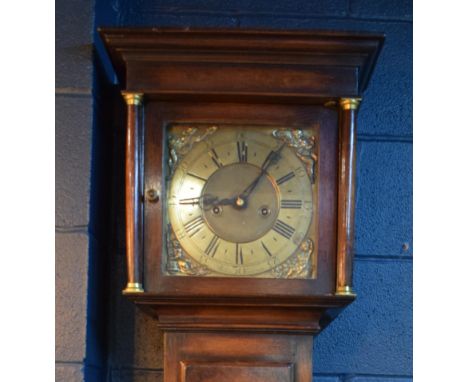 Grandfather clock by Hampson of Wrexham, 1436. Brass dial with roman numerals. Oak case with brass fittings. Chiming movement