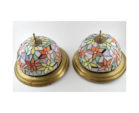 A pair of vintage liberty style stained glass celling mounted light fitings. Floral design with brass trim.  40cm Diameter, 3