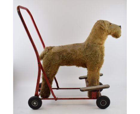 Lines Bros (Pre 1951 Triang) straw filled Fox Terrier baby walker. Original black rubber wheels and red metal painted frame. 