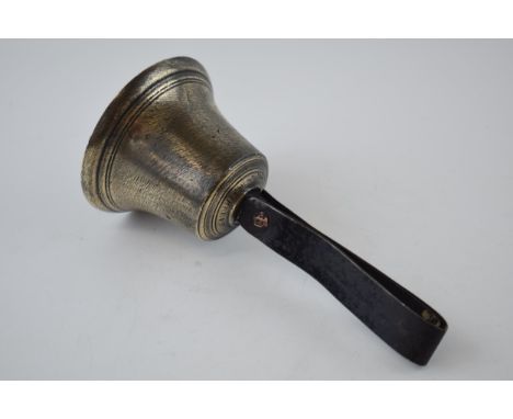 Antique cast brass hanging bell with metal strap-like handle, indistinct makers mark, possibly 'W M Filer', with clanger, 17c