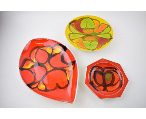A trio of Poole Pottery dishes of varying and forms and sizes, largest 31cm long (3).  In good condition with no obvious dama