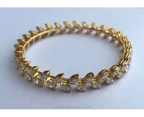 A Superb 18ct yellow gold Diamond Bangle set with 58 marquise diamonds, in two rows, each diamond 5.5mm x 3.14mm. colour clar