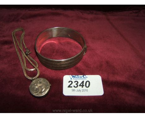 A Silver Bangle and Silver locket and chain.