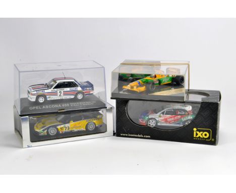 Group of diecast racing cars including IXO, Spark and one other. NM to M in Boxes. (4)