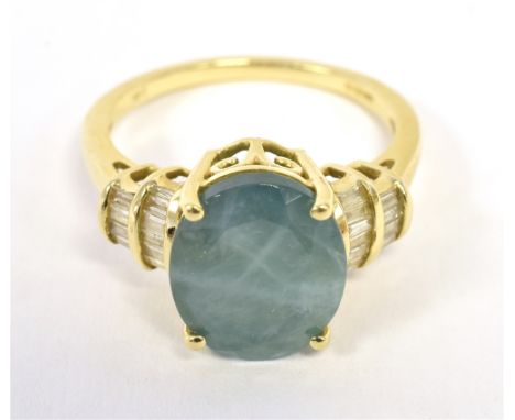 IKK GOLD PARAIBA AND DIAMOND COCKTAIL RING the faceted oval blue (turquoise) paraiba measuring approx 11 x 9mm with tiered ch