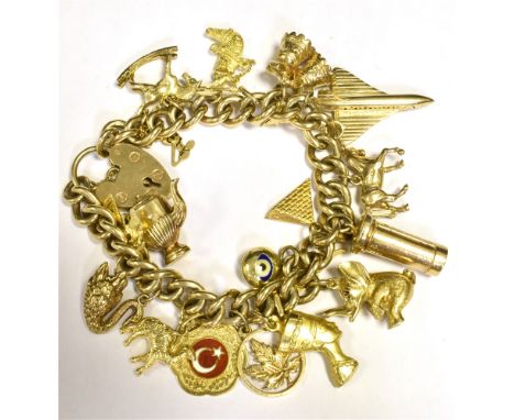 VINTAGE CHARM BRACELET Comprising 9CT gold and yellow metal working 9CT heart padlock clasp. Total weight 75g