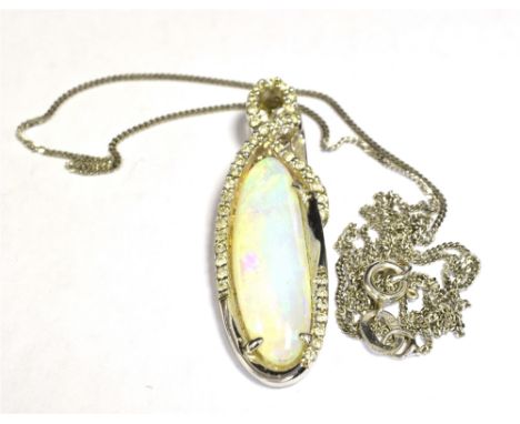 AN OPAL AND DIAMOND PENDANT AND CHAIN The oval opal mounted in diamond set white metal marked 14k DO18 measuring 3.2 x 1cm in