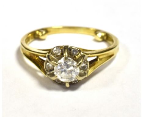 18CT GOLD ILLUSION SET DIAMOND FLOWER HEAD RING The shank with integral fitted sizer pins (part) Ring size K 1/2, weight 3.3g