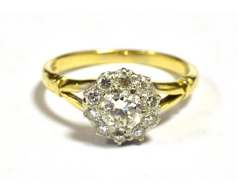 ART DECO 18CT EUROPEAN CUT DAISY DIAMOND RING, CENTRAL DIAMOND MEASURING APPROX 5mm. Ten outer diamonds measuring approx 1mm 