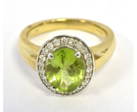 9K PERIDOT AND DIAMOND CLUSTER RING the oval cluster measuring approx 13 x 11mm, ring size O, weight 5.4g approx