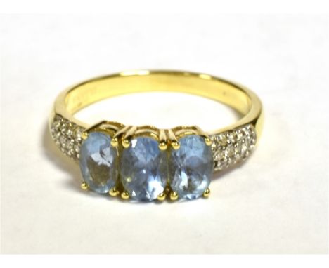 ILIANA 18K - AQUAMARINE TRIPLE STONE DRESS RING Diamond accent shoulders, Ring size O 1/2, Weight 3.8g