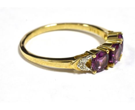 DARK PINK MORAGANITE THREE STONE DRESS RING The ring set with three faceted round morganites each measuring approx 4mm in dia