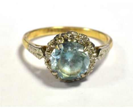 VINTAGE BLUE ZIRCON AND DIAMOND HALO RING Ring stamped 18CT Plat Ring size O 1/2, Weight 4g
