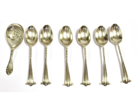 SILVER TEA CADDY SPOON together with six silver teaspoons, the caddy spoon with embossed figural scene, hallmarked Birmingham