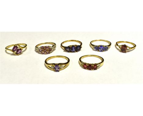 SEVEN DRESS RINGS The rings set in coloured gem, stone and paste. Yellow metal shanks marked 10K 417. Ring sizes O,P, S, S,S,