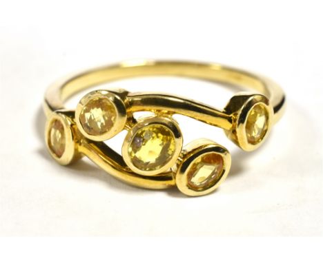 9CT GOLD YELLOW SAPPHIRE RING The ring tension set in open work boat design with five small oval sapphires, ring size U, weig