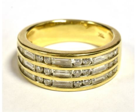 ILIANA 18K TRIPLE DIAMOND ROW HALF ETERNITY RING. The tapered band measuring 8mm in diameter at the widest section. Ring size