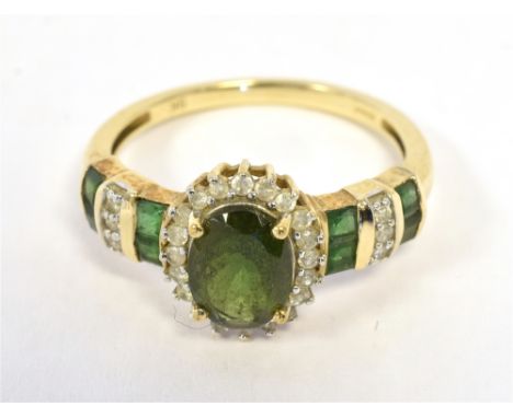 9K GEM SET COCKTAIL RING the ring set with dark green stones with clear accents, ring size P, weight 2.4g approx Condition Re