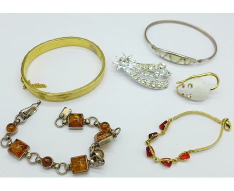 A silver and amber bracelet, silver bangle and other jewellery