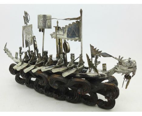 A Chinese silver model ship on a carved stand, length 22cm