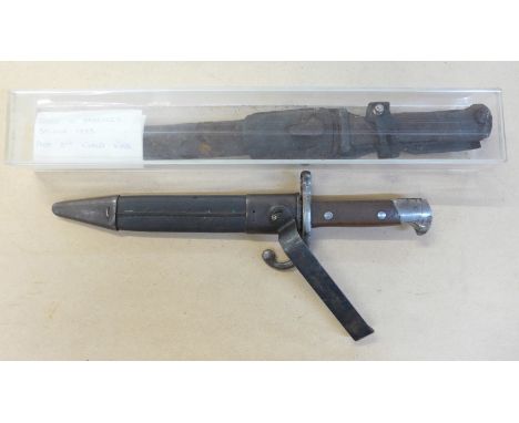A metal detecting find, bayonet in perspex case and one other bayonet and scabbard
