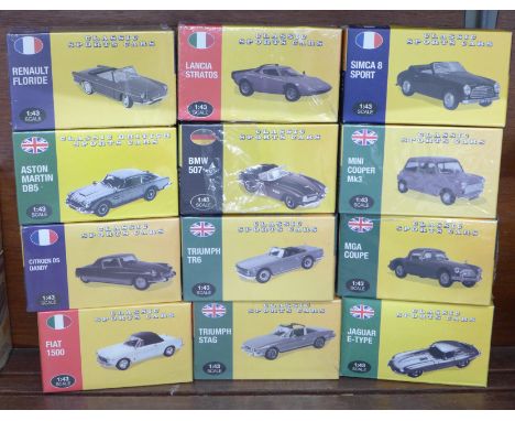 A collection of twelve Atlas 1:43 scale model vehicles, all boxed, ten sealed