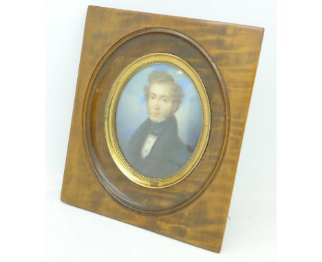 An oval watercolour half portrait miniature of a Georgian gentleman, indistinctly signed and dated, diameter 9.5cm