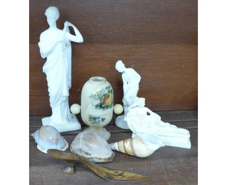 A collection of 'Grand Tour' souvenirs, including three carved shells, one shell with Bay of Naples and Vesuvius, three Roman