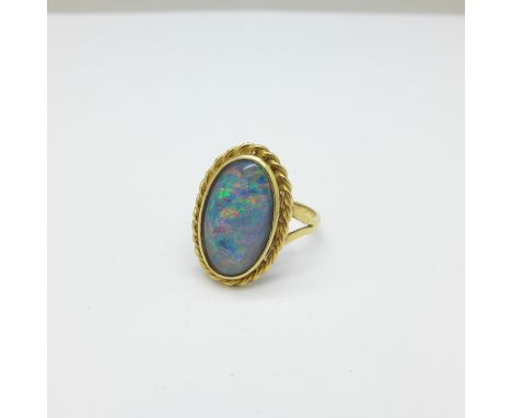 An 18ct gold and opal ring, 4.9g, P