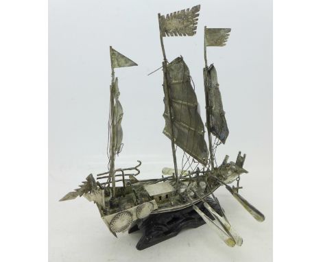 A Chinese white metal model boat on stand, height 19cm