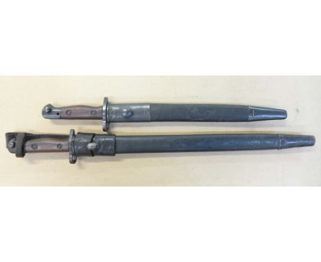 A British 1907 pattern bayonet and scabbard with leather frog and one other, the blade stamped N.W.R. (Indian rail police)