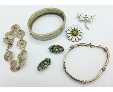 A white metal bangle, silver bracelet, a pair of silver and turquoise clip on earrings, silver and amethyst bracelet, etc.