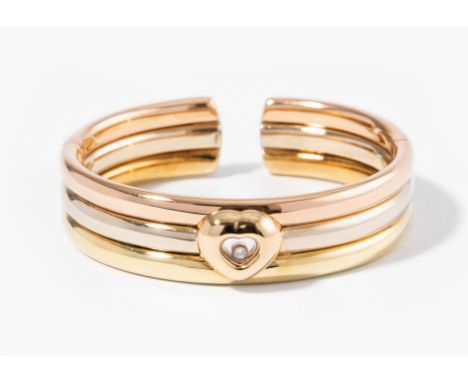 Chopard Brillant-Armspange750 Gelb-/Weiss-/Rotgold. Herzmotiv auf Schauseite mit beweglichem Brillant ca. 2 mm. Innenumfang 1