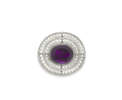 CARTIER: AMETHYST, DIAMOND AND SEED PEARL BROOCH, CIRCA 1908The amethyst cabochon, within a surround alternating with rows of