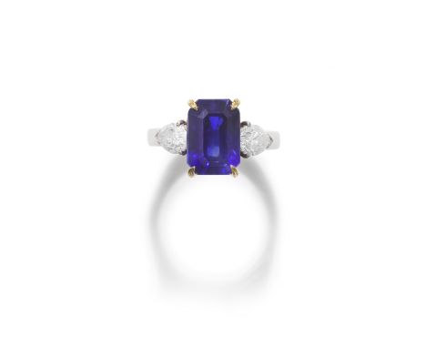 SAPPHIRE AND DIAMOND RINGThe step-cut sapphire, weighing 6.11 carats, between pear-shaped diamond shoulders, ring size K1⁄2Fo