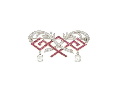 CARTIER: RUBY AND DIAMOND BROOCH, CIRCA 1910Each cushion-shaped, rose and single-cut diamond scrolling palm frond, entwined w
