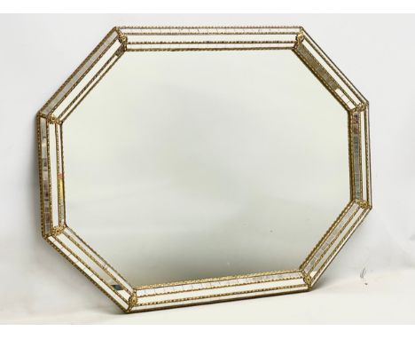 A large ornate brass framed mirror. 100x75cm 