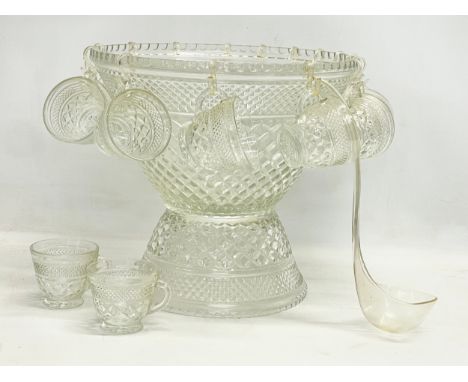 A large vintage 2 piece cut glass punch bowl and 17 matching cups. 35x33cm 