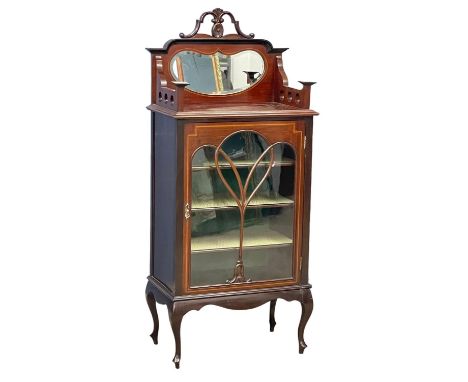 An Edwardian inlaid mahogany mirror back music cabinet on cabriole legs. 61x37x140cm 