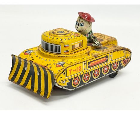 A vintage tin plate ‘T-12’ windup truck. K.O, Japan. 16cm 